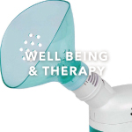 Image of white and turquoise steam inhaler on a white background. White text overlay says 