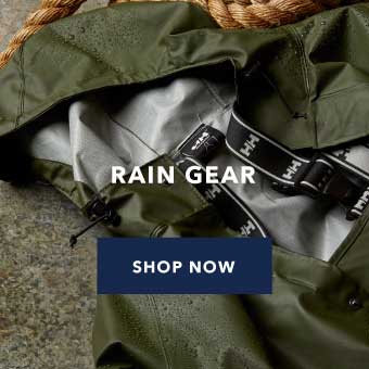Image of an olive green rain jacket laid on top of concrete. White text overlay says 