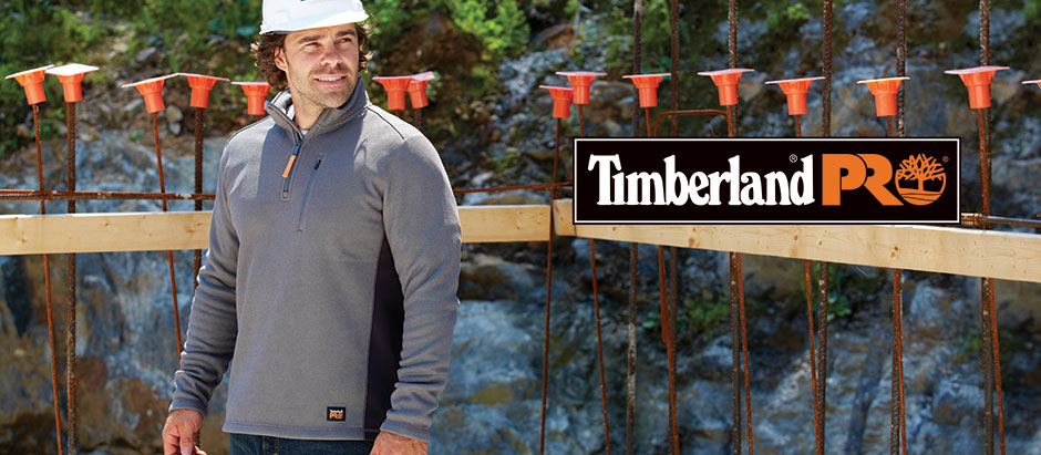 Image of a man working outside wearing a hard hat. Timberland Pro logo is overlaid.